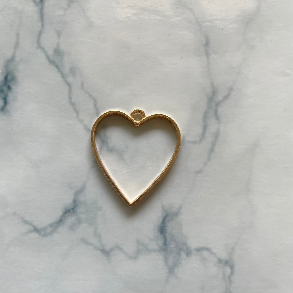 Heart shaped gold open bezel