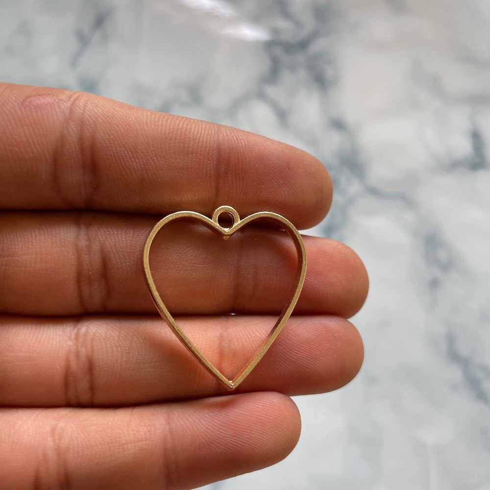 Heart shaped gold open bezel